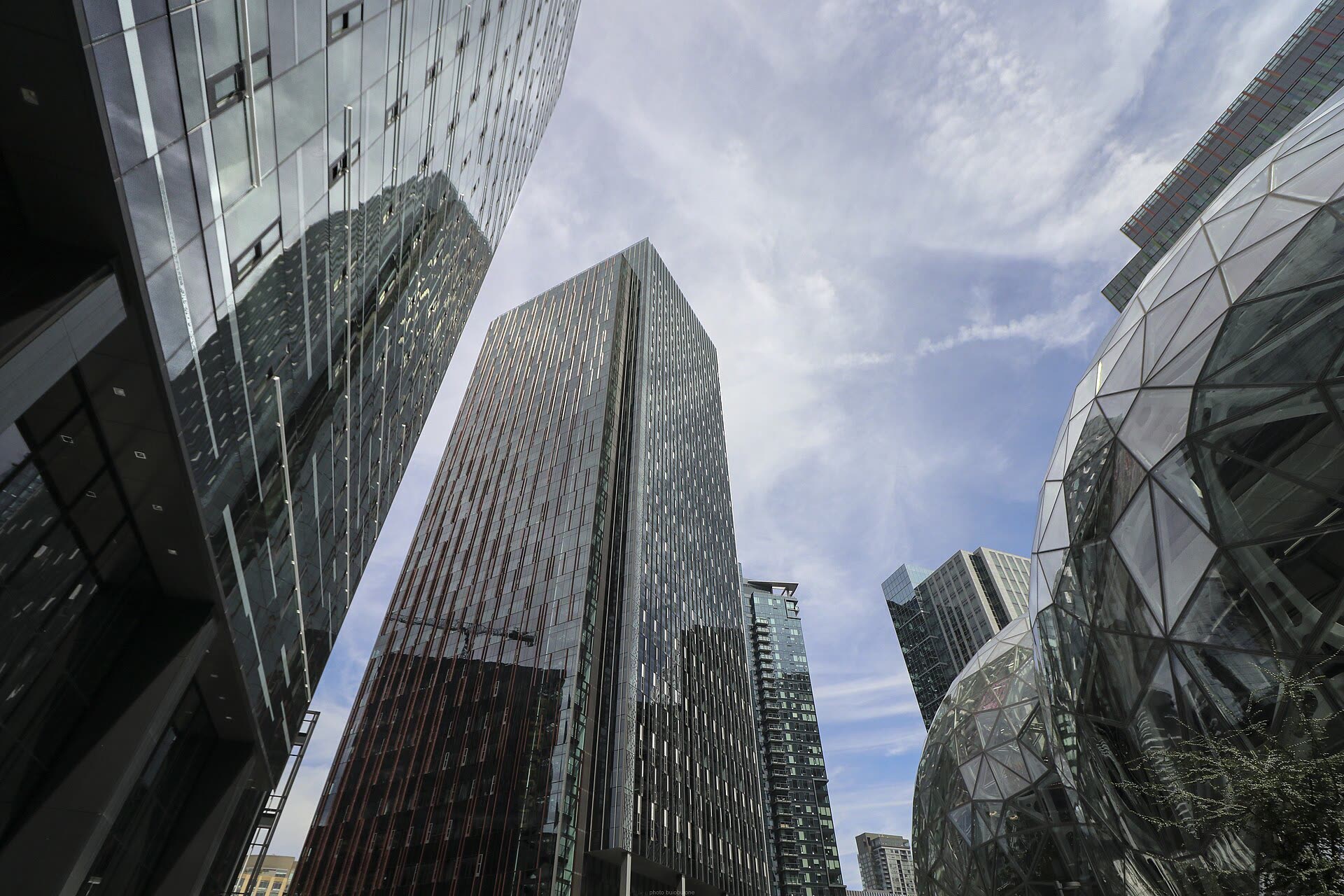 Amazon's glass Spheres and office towers at its Seattle headquarters, seen from street level