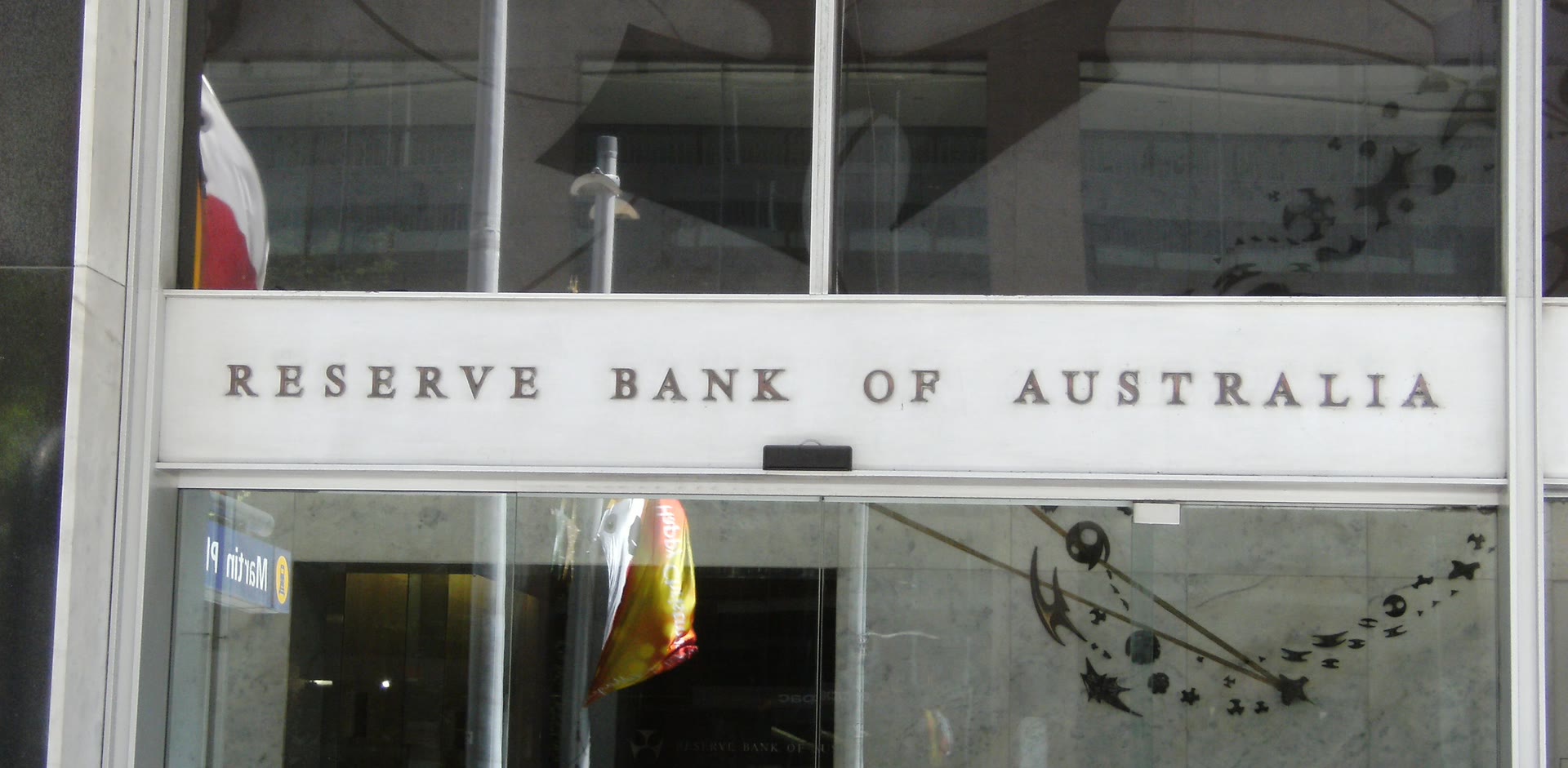 The Reserve Bank of Australia sign above the glass entrance of its head office in Martin Place, Sydney
